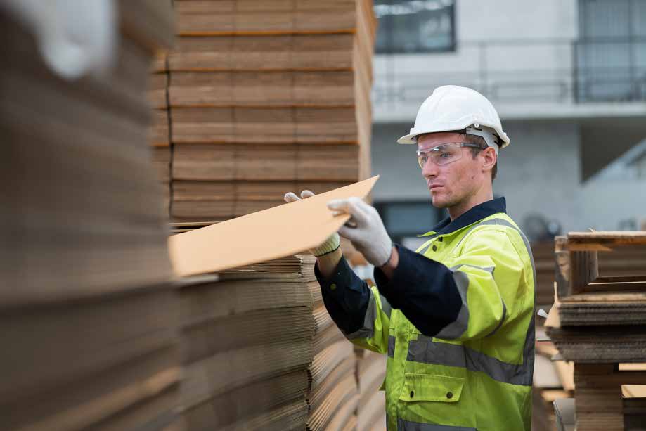 Ribble Packaging warehouse worker handling corrugated board